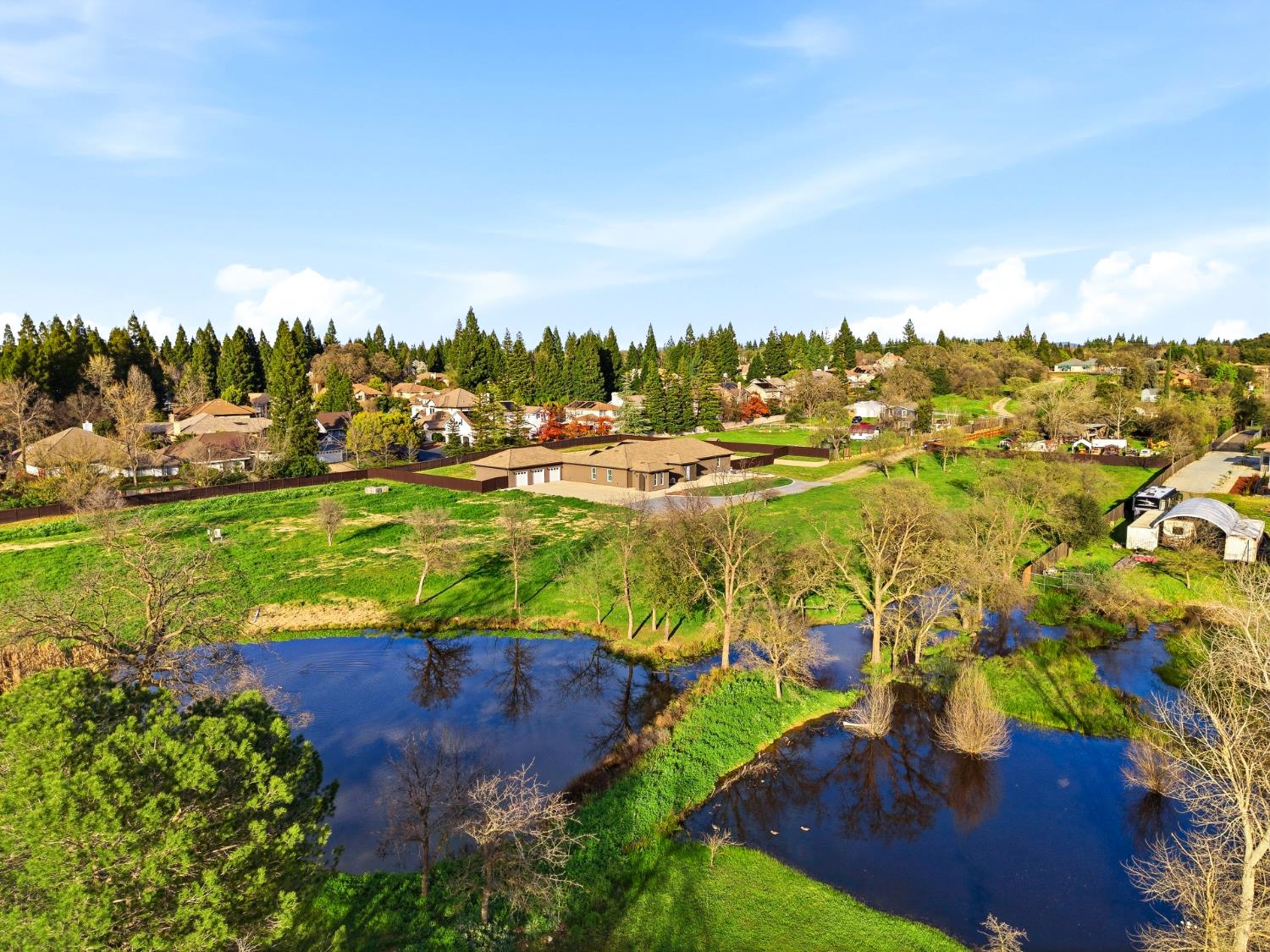 an aerial view of a houses with yard