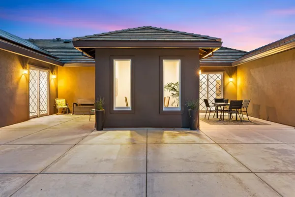 a kitchen with kitchen island a sink a stove and cabinets
