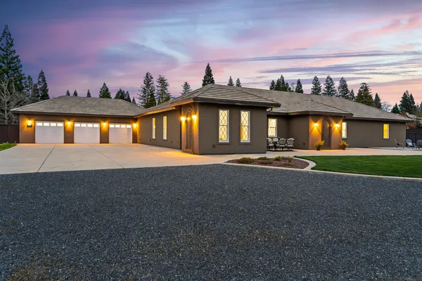 a kitchen with a sink and a stove with cabinets