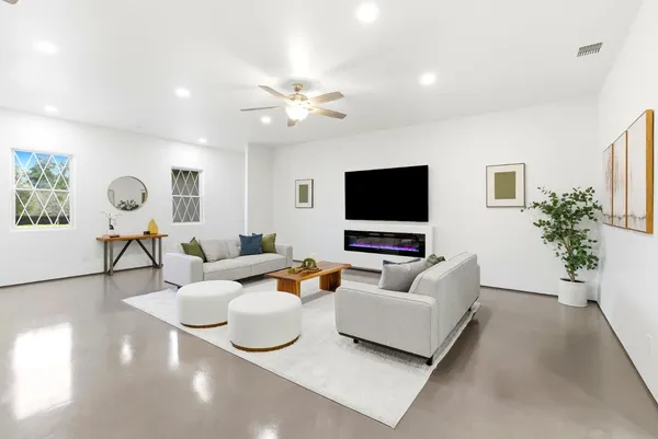 a spacious bedroom with a bed and furniture