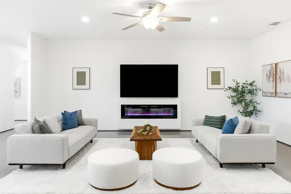 a bedroom with a bed and a potted plant