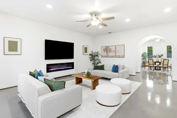 a spacious bedroom with a bed and a table