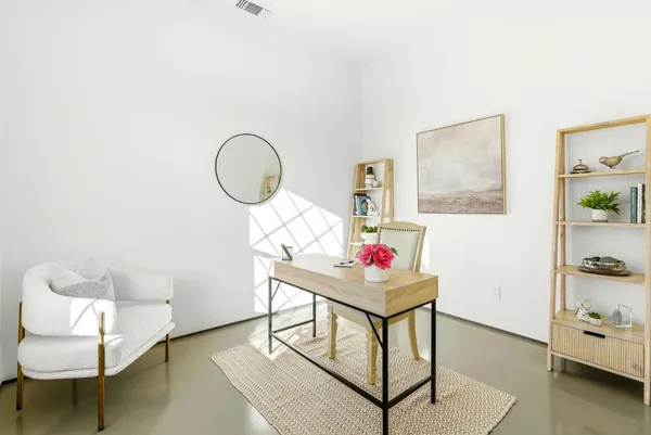 a bedroom with bed and window