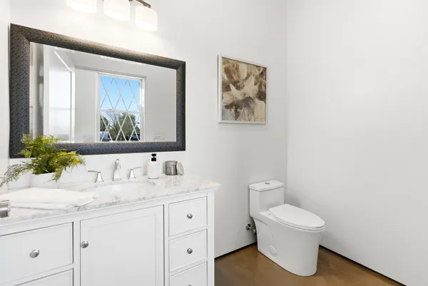 a living room with furniture flowerpot and window