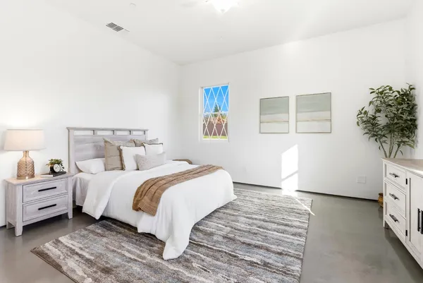 a bathroom with a sink a toilet and a shower