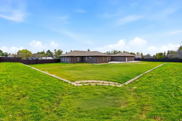 an aerial view of a house having swimming pool garden and patio
