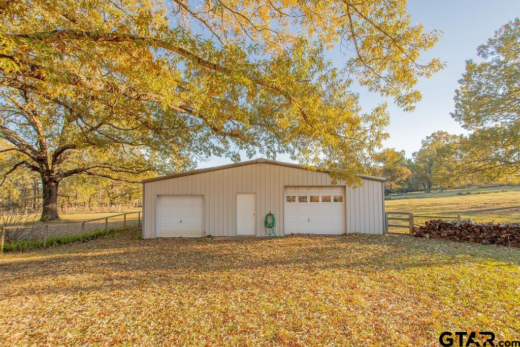 12575 FM 3271 Tyler, TX 75704 - Photo 14 of 47 a view of a entrance gate of the house and trees