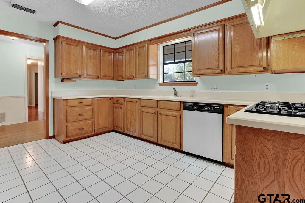 12575 FM 3271 Tyler, TX 75704 - Photo 19 of 47 a kitchen with stainless steel appliances granite countertop a sink and cabinets