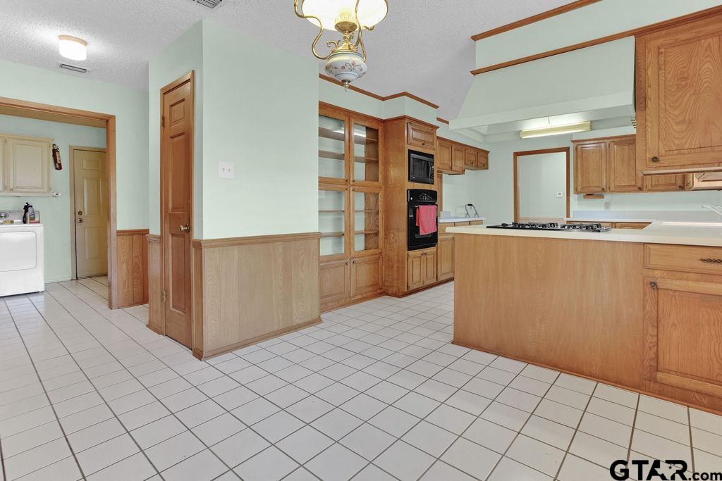 12575 FM 3271 Tyler, TX 75704 - Photo 21 of 47 a kitchen with stainless steel appliances granite countertop a refrigerator and a stove