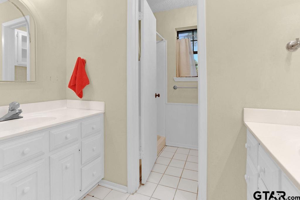 12575 FM 3271 Tyler, TX 75704 - Photo 29 of 47 a bathroom with a sink and a mirror