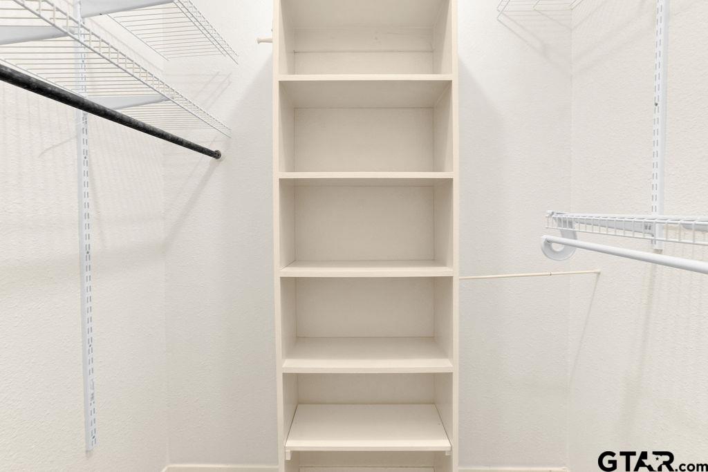 12575 FM 3271 Tyler, TX 75704 - Photo 32 of 47 a view of walk in closet with empty racks