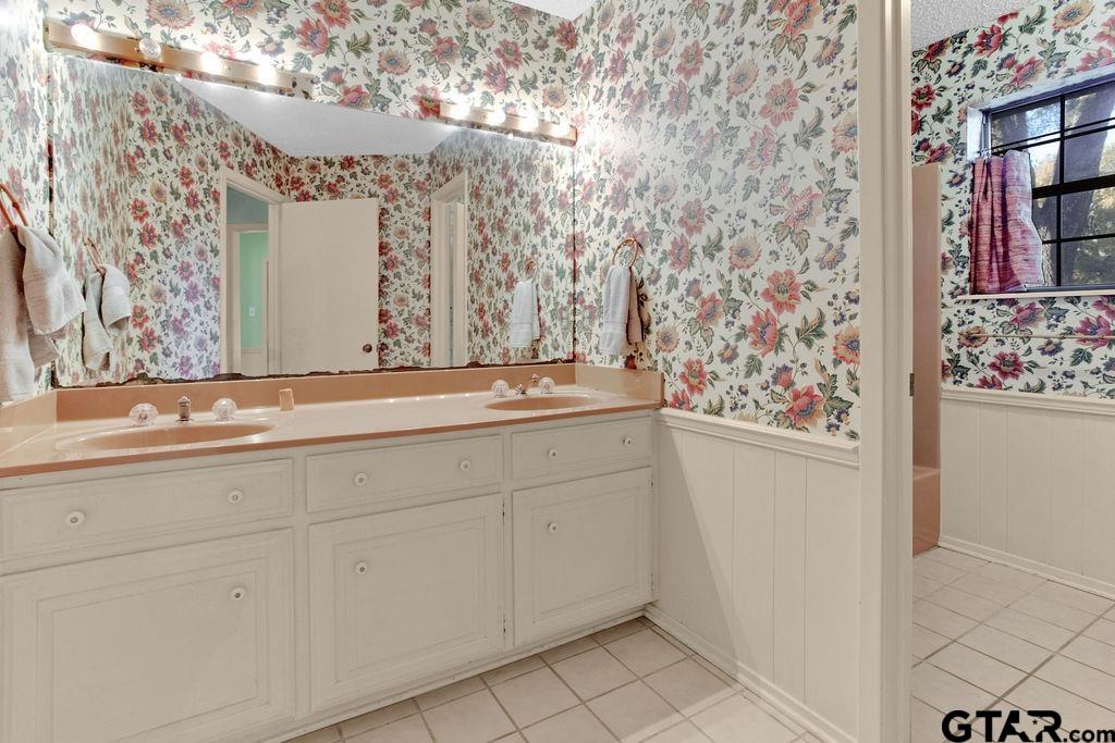 12575 FM 3271 Tyler, TX 75704 - Photo 33 of 47 a bathroom with a sink and a mirror