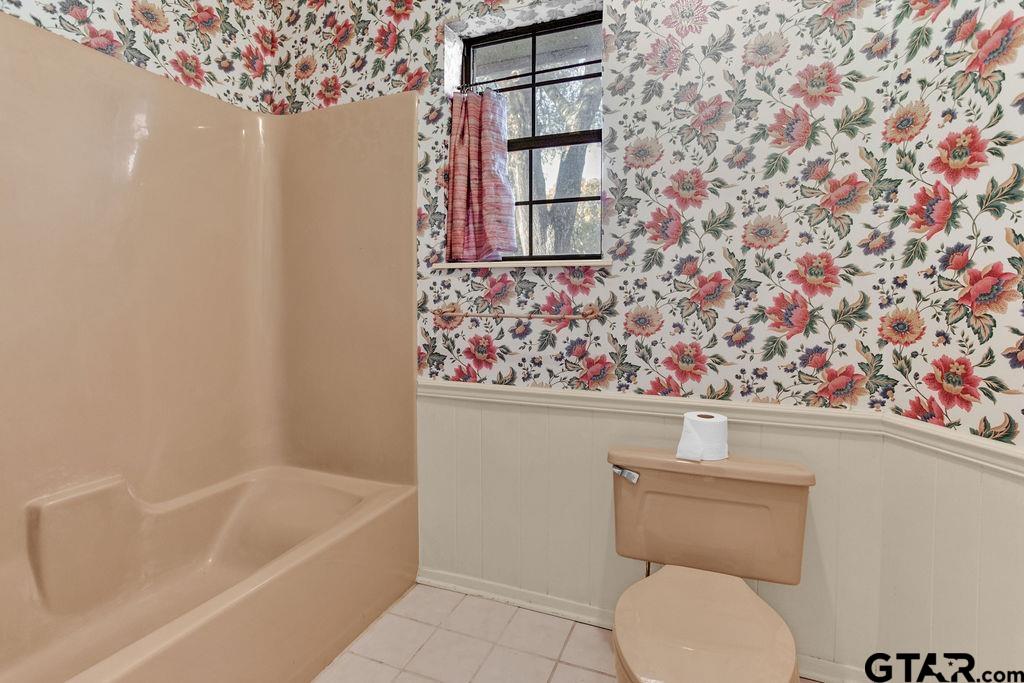 12575 FM 3271 Tyler, TX 75704 - Photo 34 of 47 a bathroom with a toilet and a bathtub