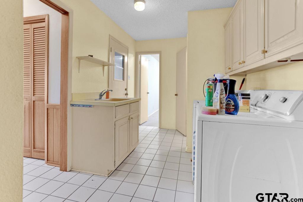 12575 FM 3271 Tyler, TX 75704 - Photo 35 of 47 a kitchen with sink cabinets and stove