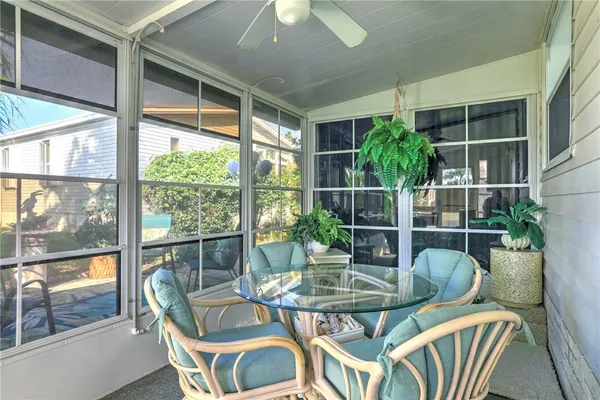 a view of a dining room with furniture window and outside view