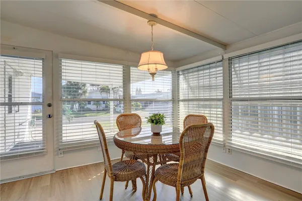 a dining room with furniture window and outside view