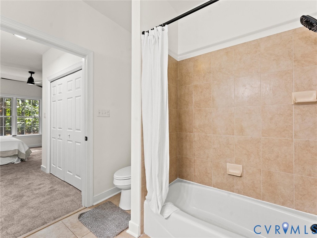 12 Henderson Road New Canton, VA 23123 - Photo 32 of 49 Bathroom featuring a white bathtub with a tiled su