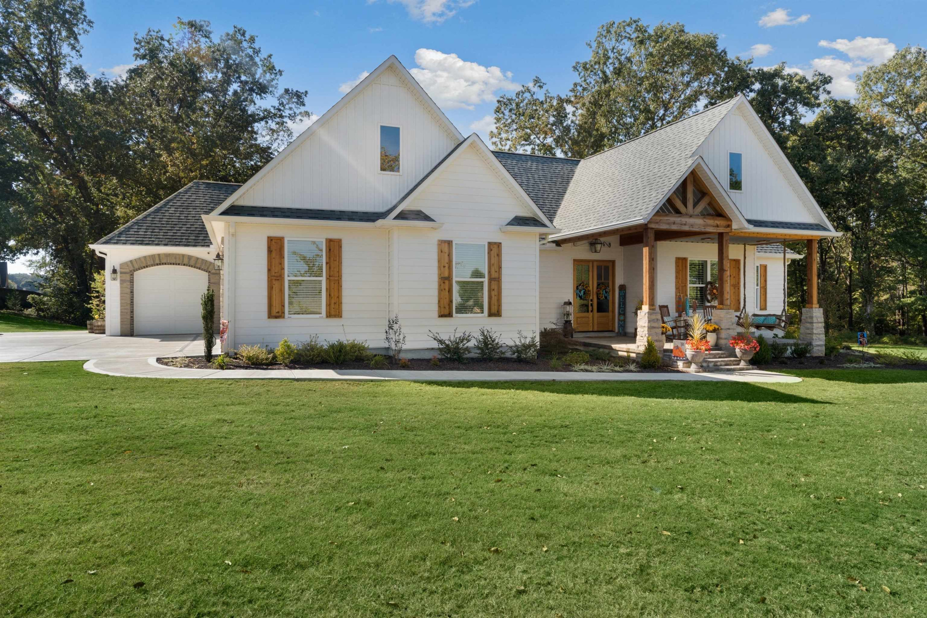 a front view of a house with garden