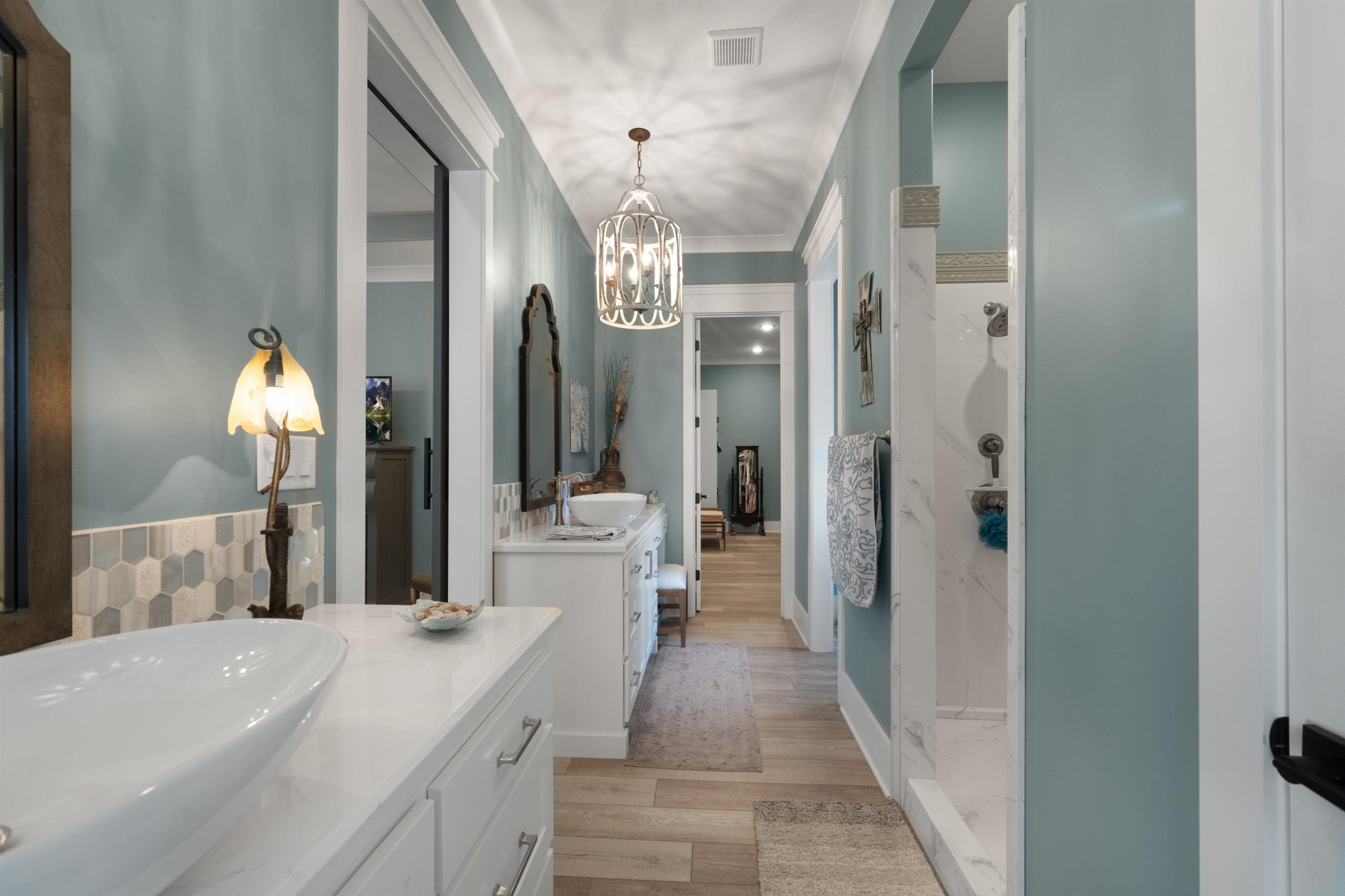 491 Cooper Anderson Road Jackson, TN 38305 - Photo 18 of 30 a spacious bathroom with a shower a sink and a mirror