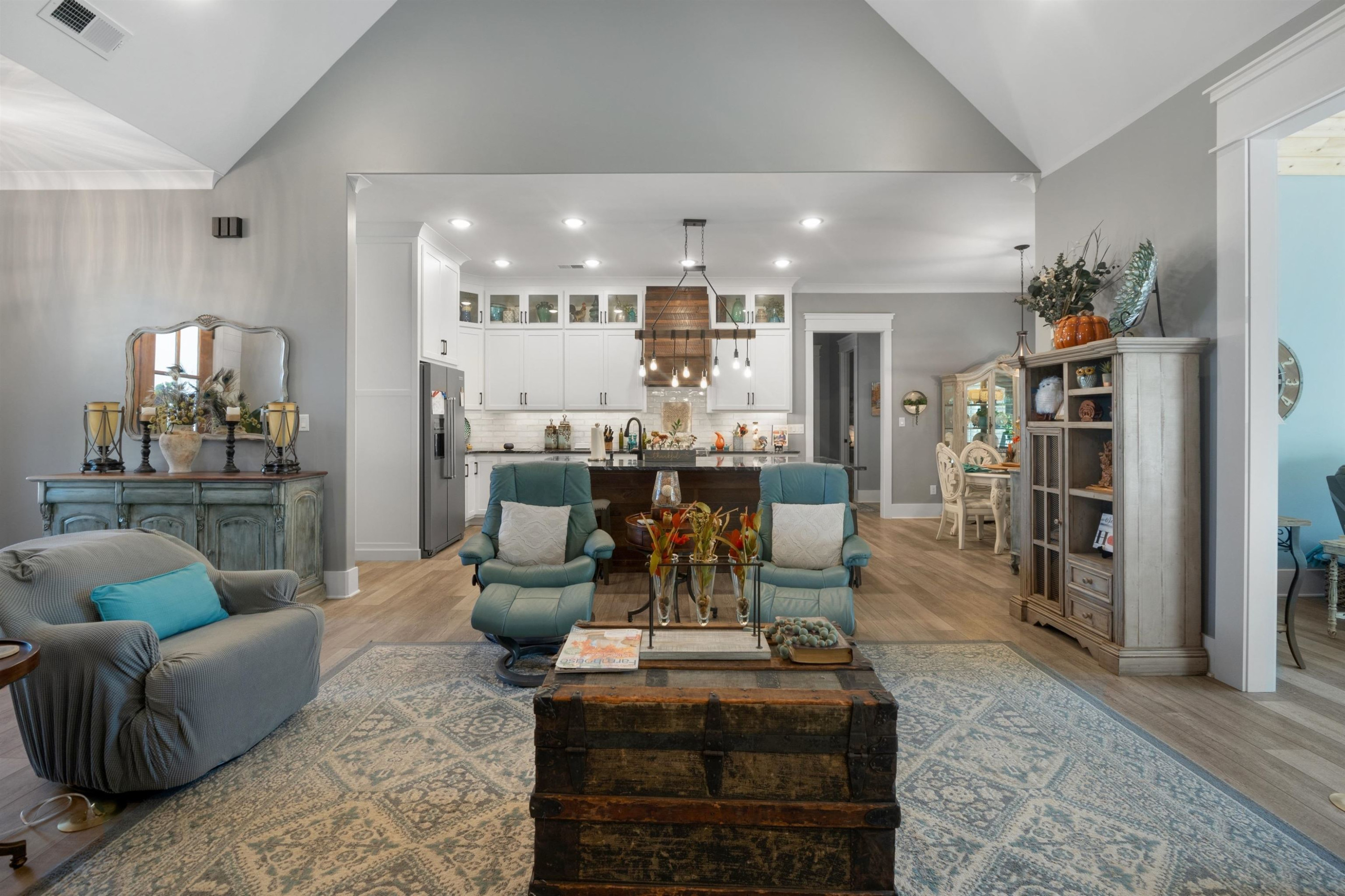 491 Cooper Anderson Road Jackson, TN 38305 - Photo 5 of 30 a living room with furniture and a dining table with kitchen view