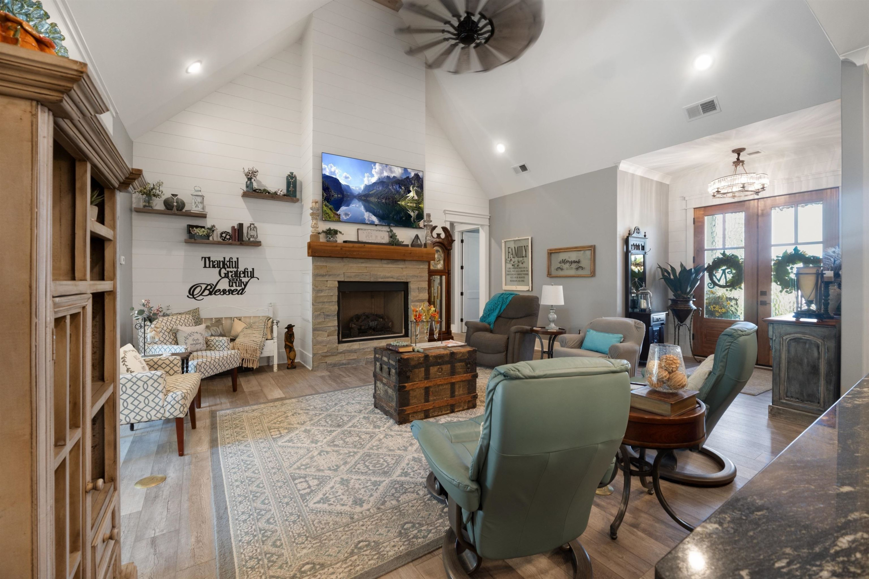 491 Cooper Anderson Road Jackson, TN 38305 - Photo 8 of 30 a living room with furniture a fireplace and a flat screen tv