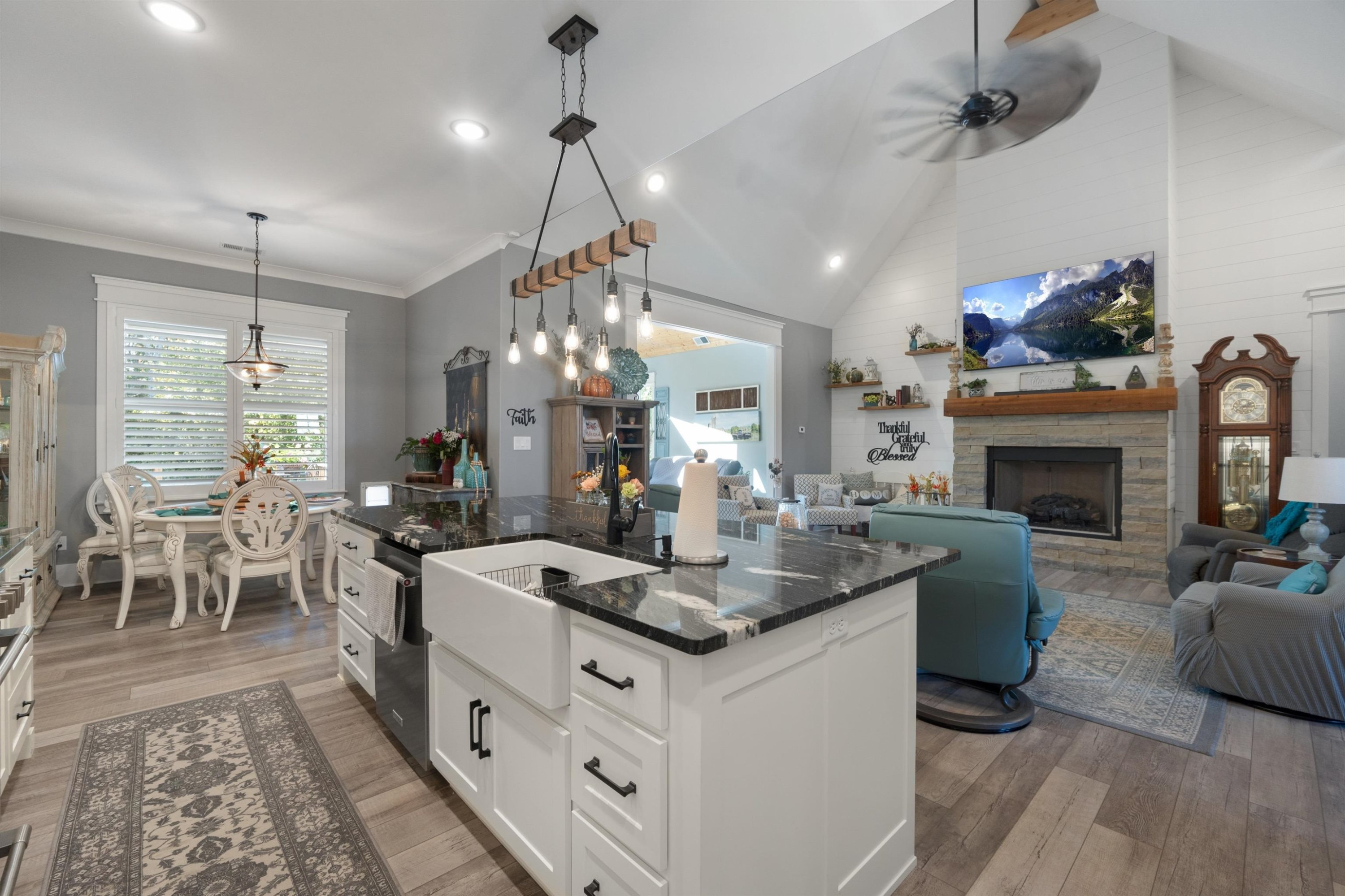 491 Cooper Anderson Road Jackson, TN 38305 - Photo 10 of 30 a very nice looking kitchen with granite countertop a stove dining table chairs and a chandelier
