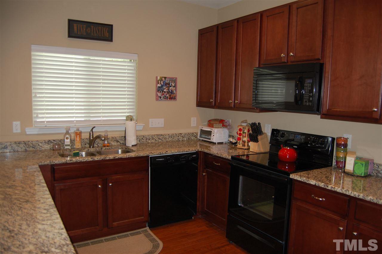 313 Riversville Court Cary, NC 27519 - Photo 2 of 25 Another view of kitchen. Refrigerator stays.