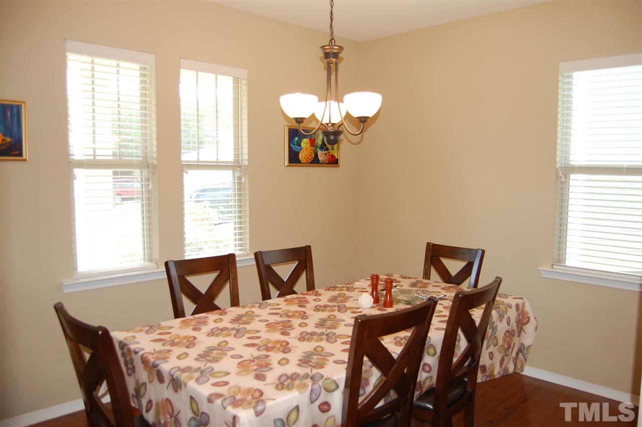 313 Riversville Court Cary, NC 27519 - Photo 10 of 25 Dining Room is located right of the foyer with a wall providing privacy from visitors at the door. This is a multipurpose room that can be used as a dining room, living room, office or playroom.