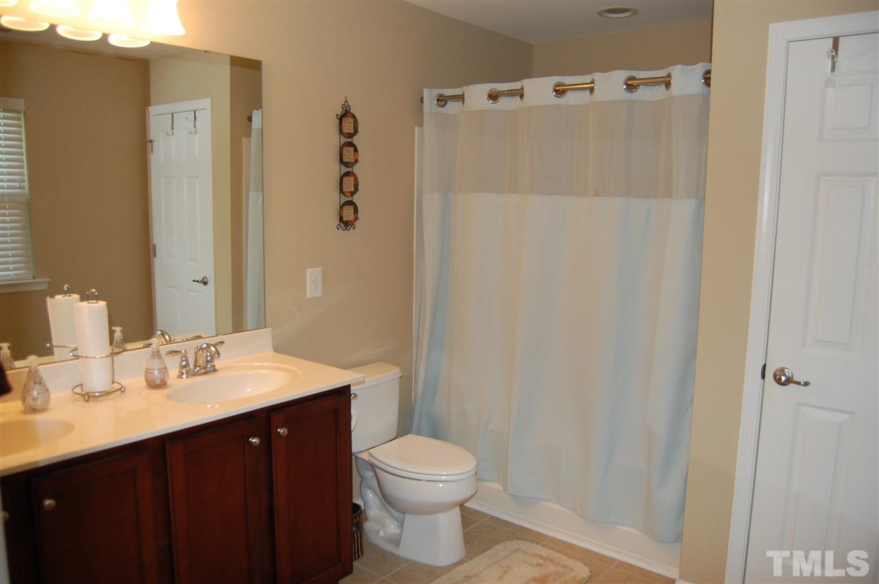 313 Riversville Court Cary, NC 27519 - Photo 15 of 25 Master bath has double vanity with a tub/shower.