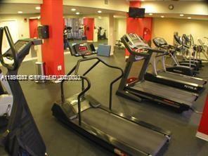 780 Northeast 69th Street, Unit 1406 Miami, FL 33138 - Photo 6 of 22 a view of a room with gym equipment