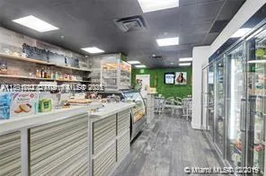 a bathroom with a sink a mirror and a shower