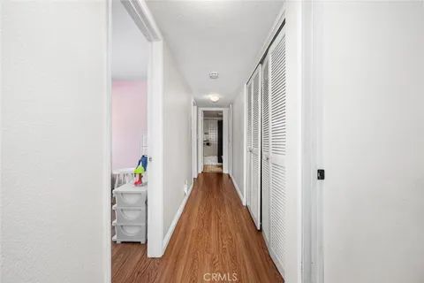 a living room with furniture a rug and a wooden floor