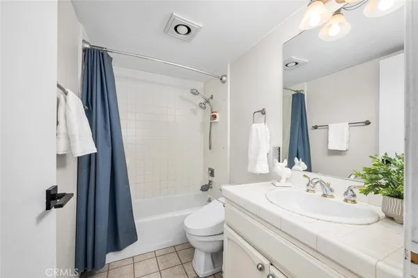 a bathroom with a toilet and a bathtub