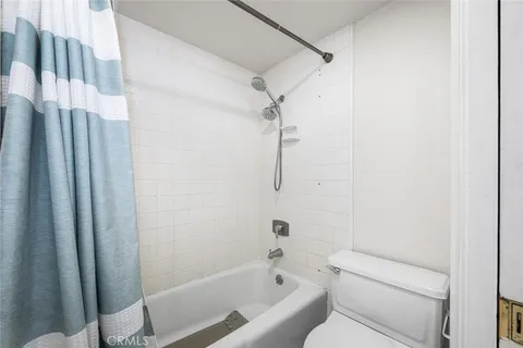 a bathroom with a sink vanity granite and a mirror