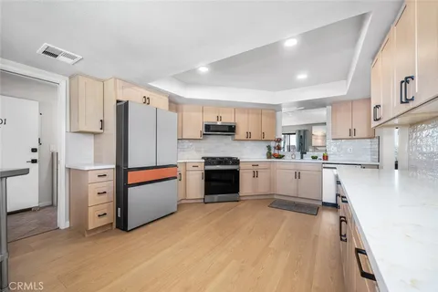 a view of a livingroom with furniture window and wooden floor