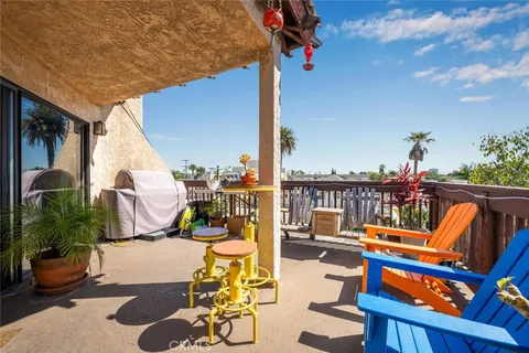 a view of a balcony with chairs