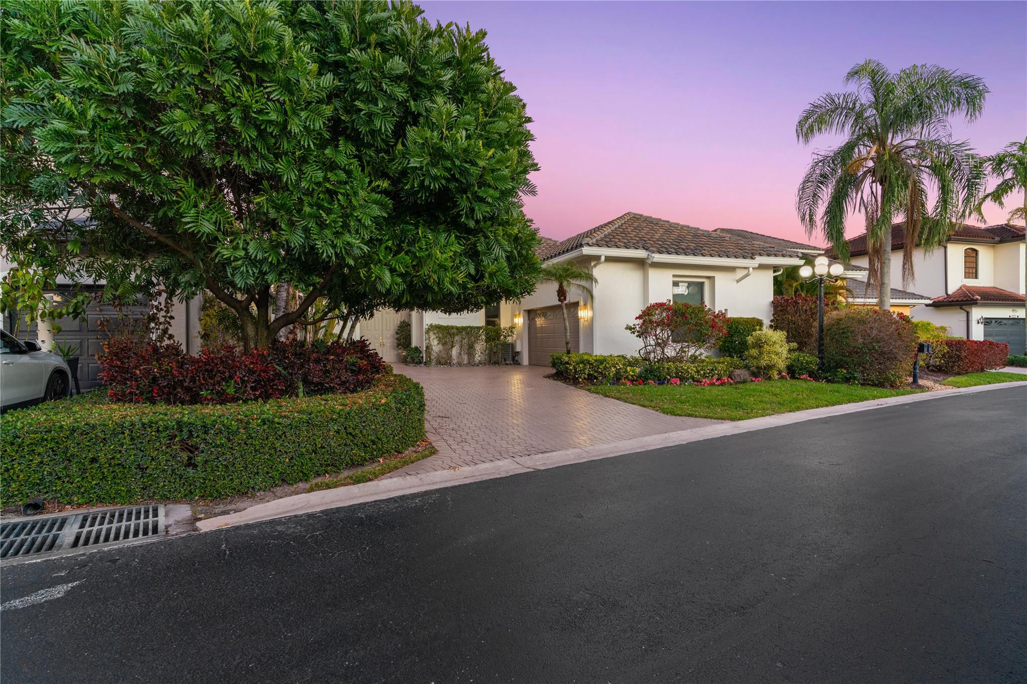 22722 El Dorado Drive Boca Raton, FL 33433 - Photo 1 of 50 a front view of a house with a garden and yard