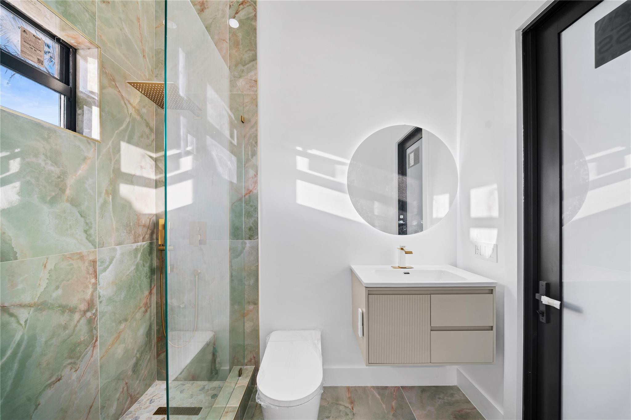 22722 El Dorado Drive Boca Raton, FL 33433 - Photo 12 of 50 a bathroom with a sink vanity mirror and toilet