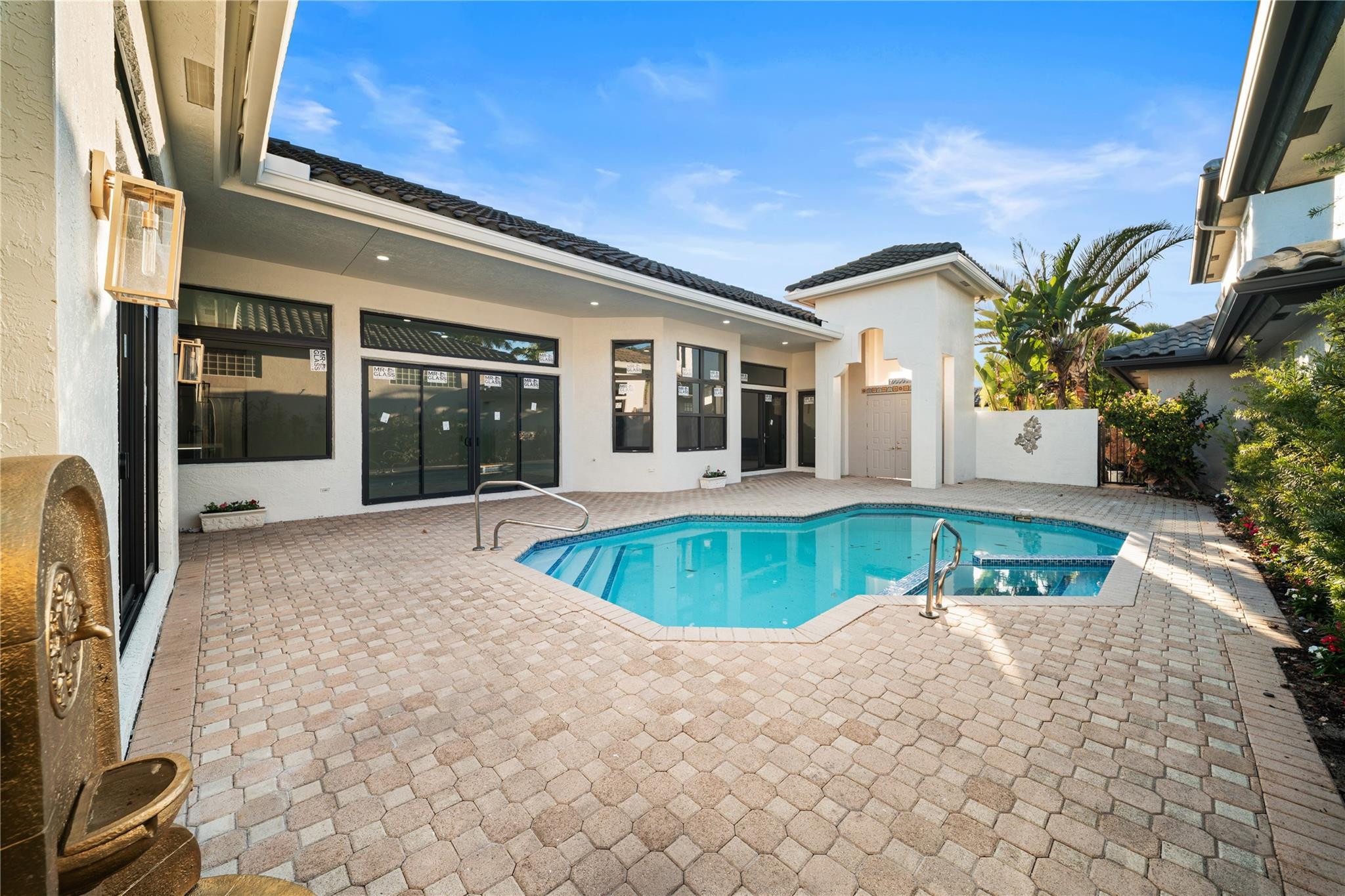 22722 El Dorado Drive Boca Raton, FL 33433 - Photo 17 of 50 a front view of a house with a yard