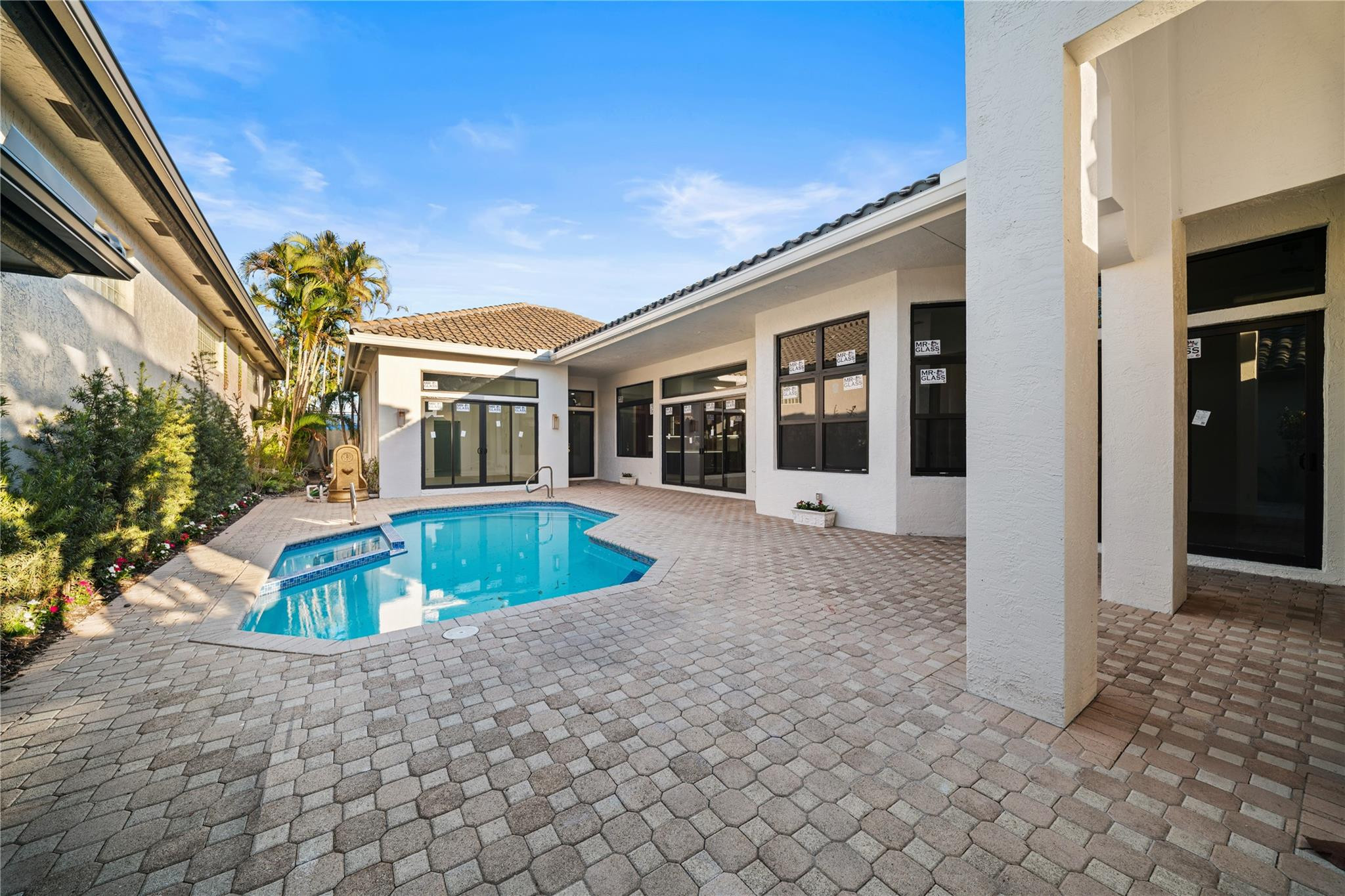 22722 El Dorado Drive Boca Raton, FL 33433 - Photo 20 of 50 a front view of a house with garden