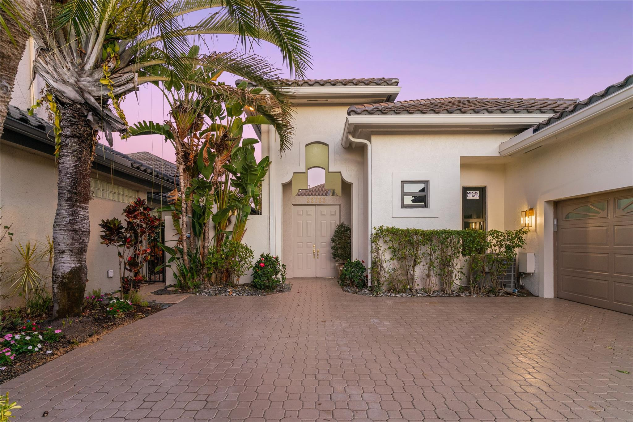 22722 El Dorado Drive Boca Raton, FL 33433 - Photo 2 of 50 a front view of a house with a yard