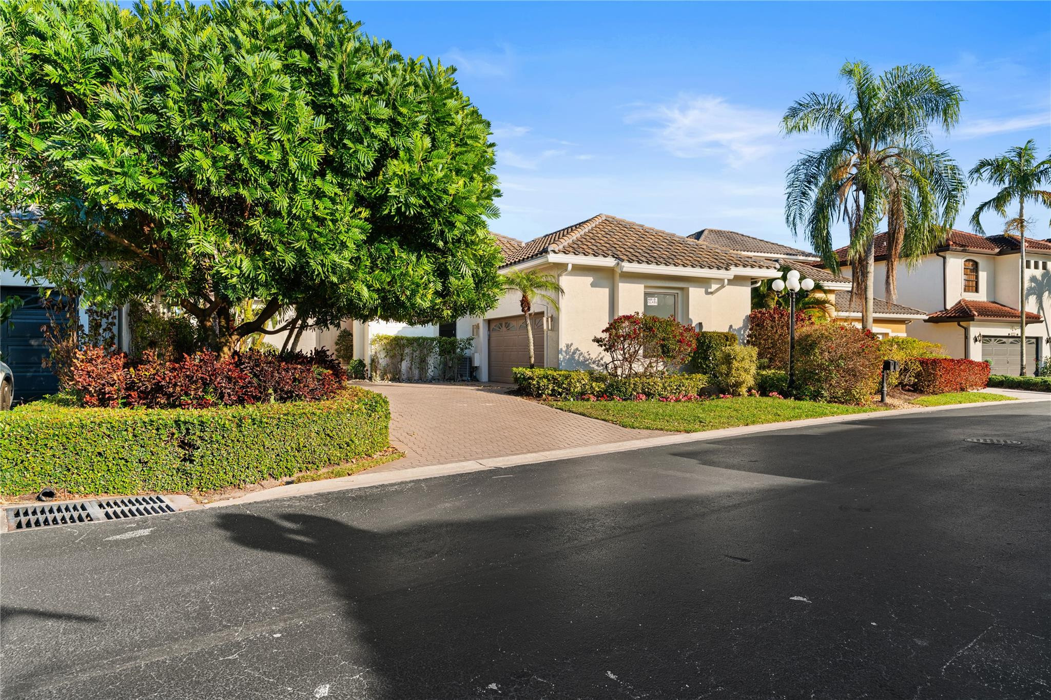 22722 El Dorado Drive Boca Raton, FL 33433 - Photo 21 of 50 a front view of a house with a yard and garage