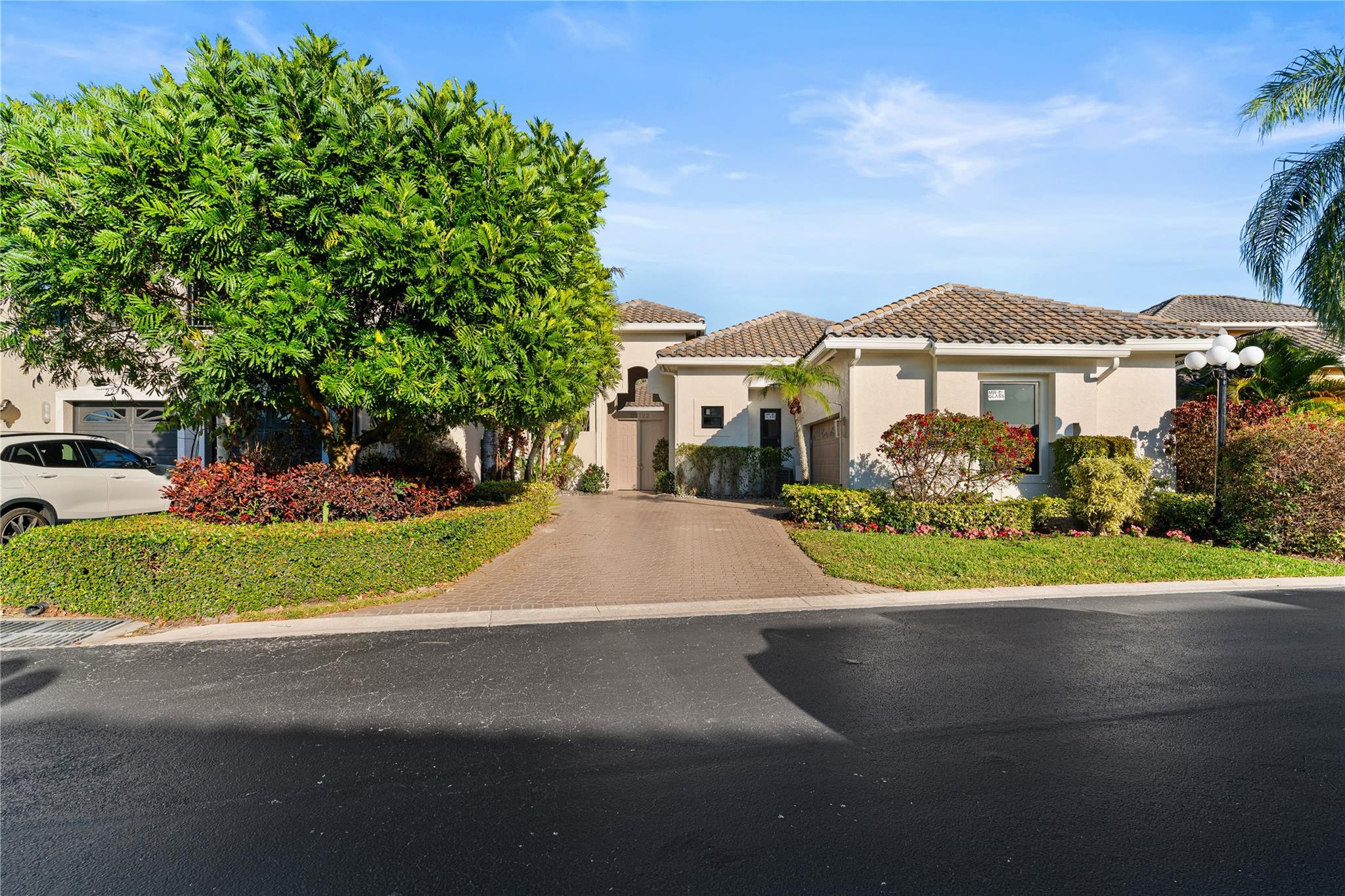 22722 El Dorado Drive Boca Raton, FL 33433 - Photo 22 of 50 a front view of a house with a yard and a garage