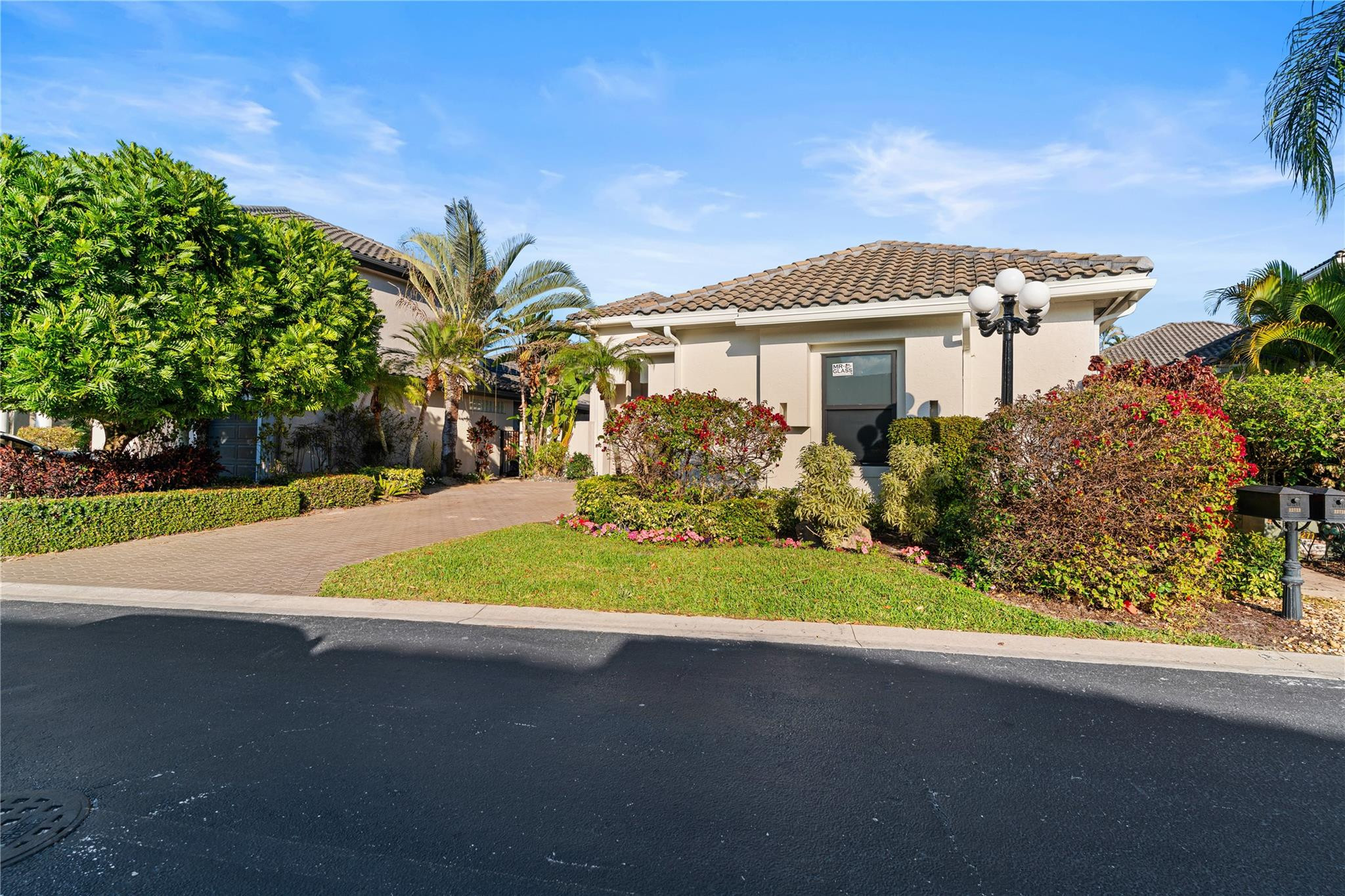22722 El Dorado Drive Boca Raton, FL 33433 - Photo 23 of 50 a front view of a house with a yard and garage