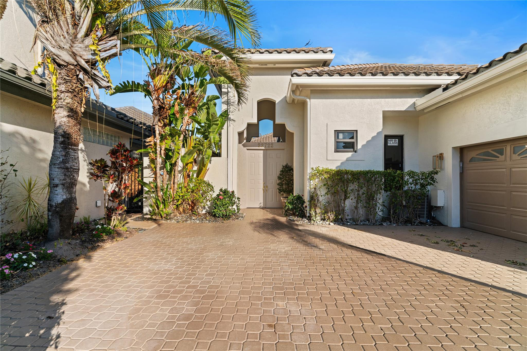 22722 El Dorado Drive Boca Raton, FL 33433 - Photo 24 of 50 a view of a blue house with a street