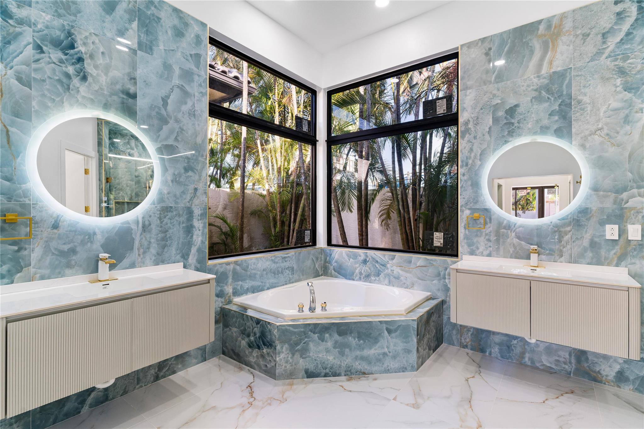 22722 El Dorado Drive Boca Raton, FL 33433 - Photo 29 of 50 a spacious bathroom with a tub sink and mirror