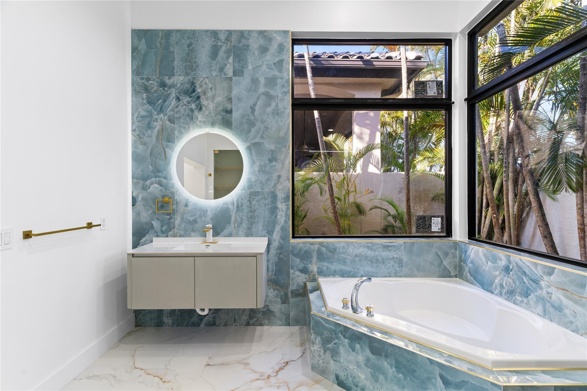 22722 El Dorado Drive Boca Raton, FL 33433 - Photo 32 of 50 a bathroom with a sink and a bathtub