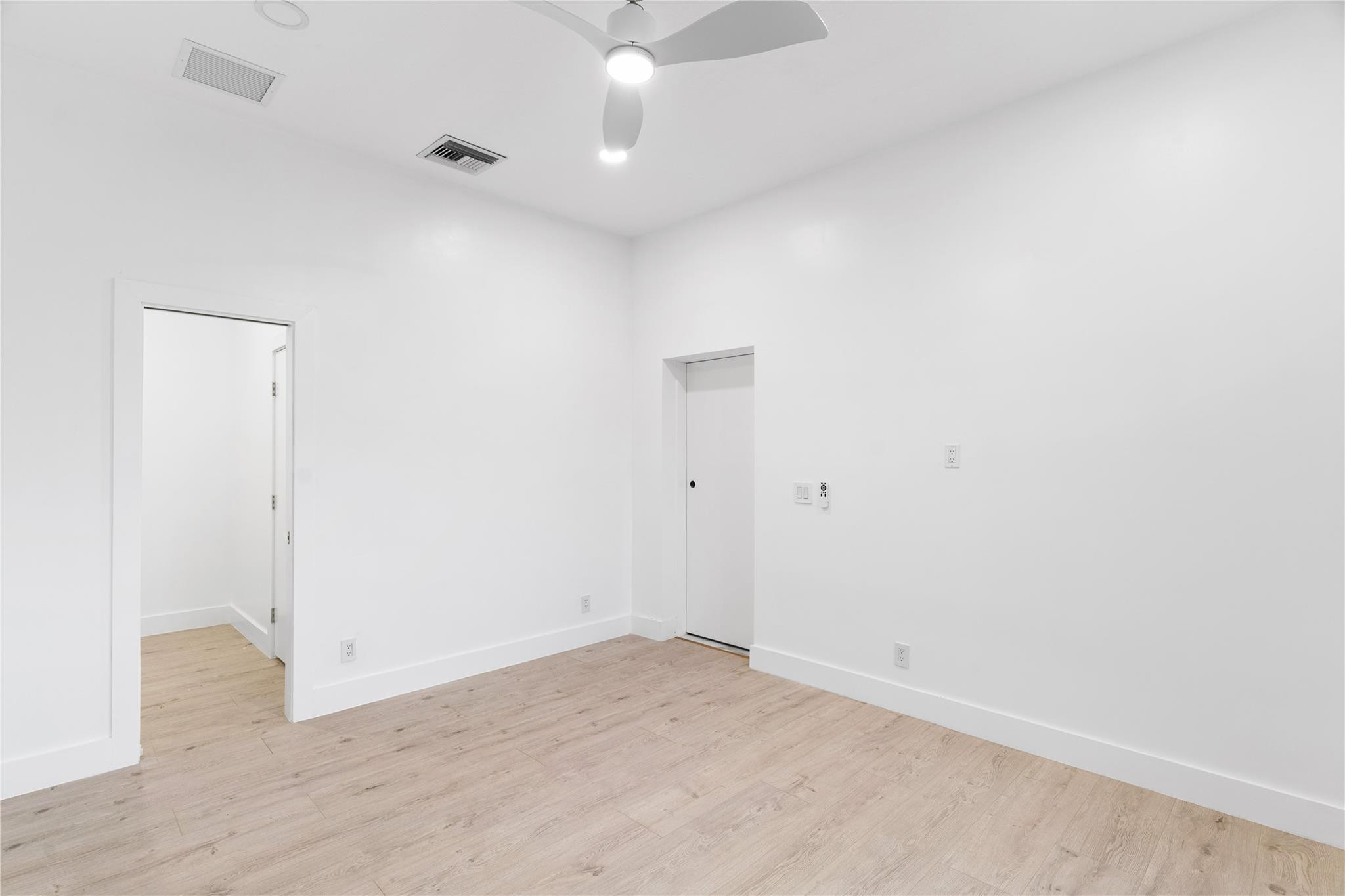 22722 El Dorado Drive Boca Raton, FL 33433 - Photo 36 of 50 an empty room with a ceiling fan and wooden floor