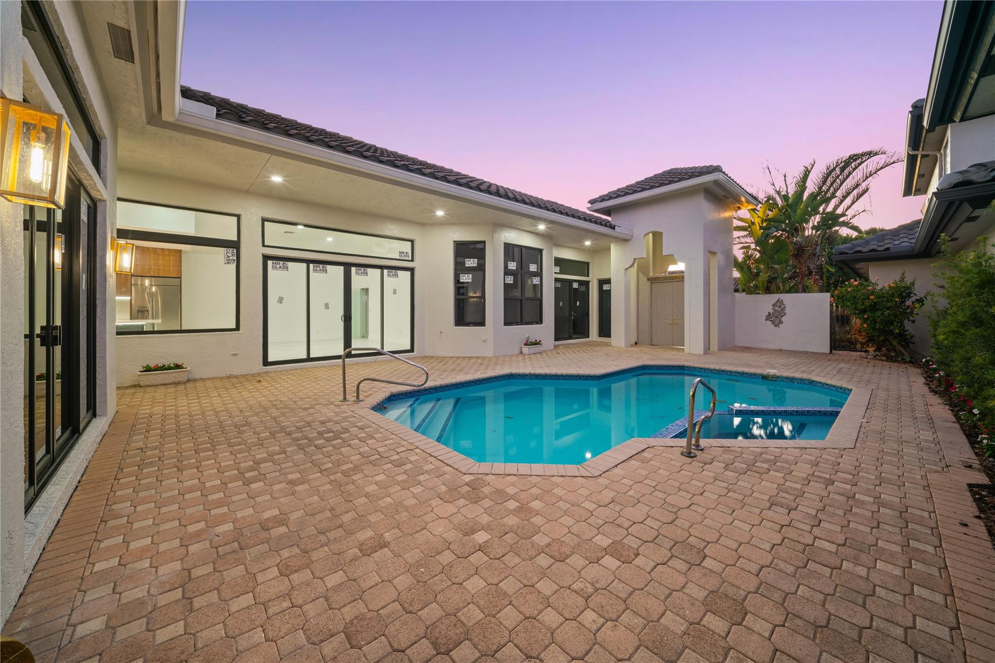 22722 El Dorado Drive Boca Raton, FL 33433 - Photo 4 of 50 a front view of a house with a yard and potted plants