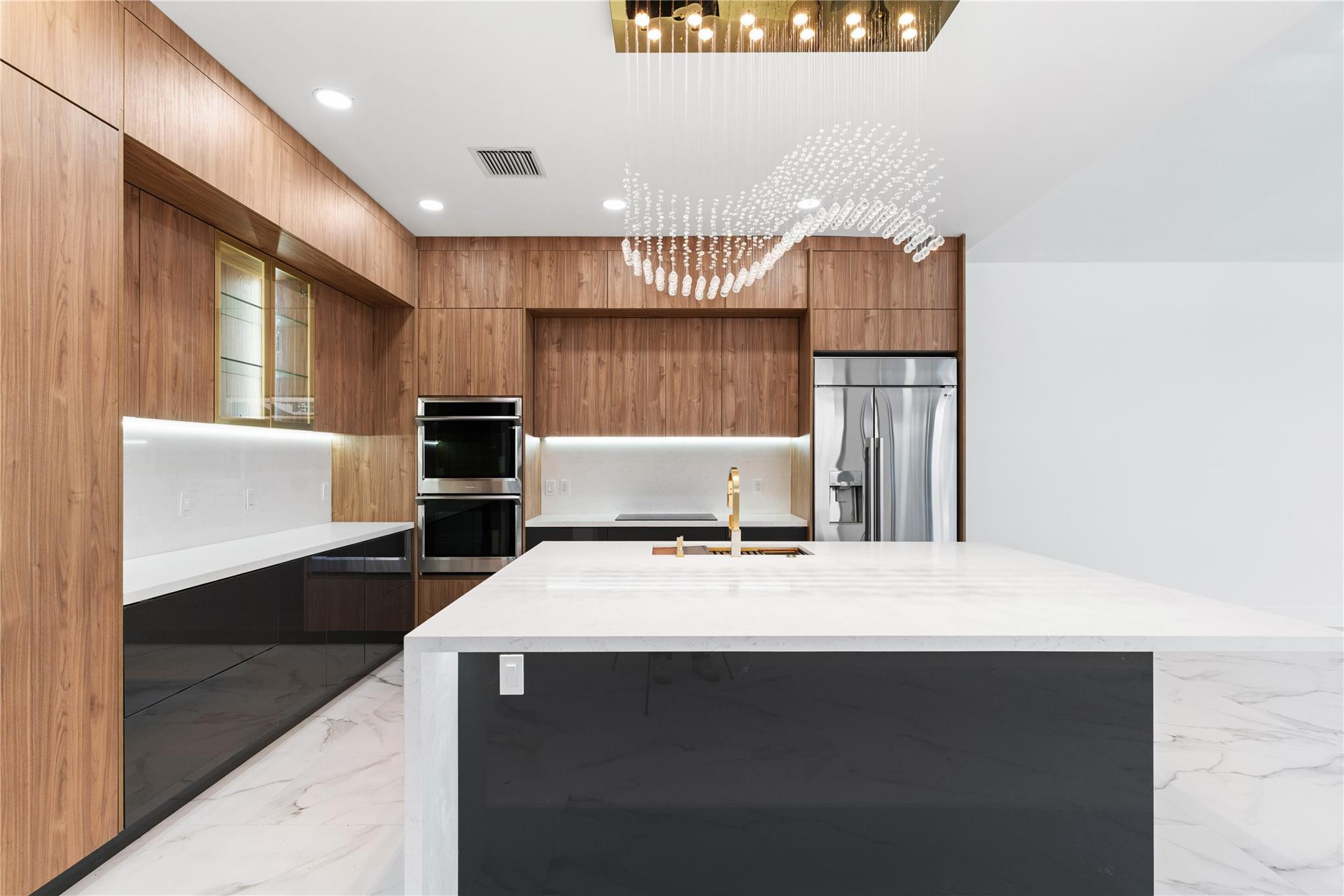 22722 El Dorado Drive Boca Raton, FL 33433 - Photo 7 of 50 a kitchen with kitchen island sink refrigerator and stove